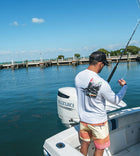 Salinity Gear performance SPF 50 sun protection dri-fit long sleeve fishing shirt. White shirt with screen printed rasta sailfish fish rubbing ( gyotaku ) design. The left sleeve has a rubbing of a ballyhoo and the front has a Salinity Gear logo.